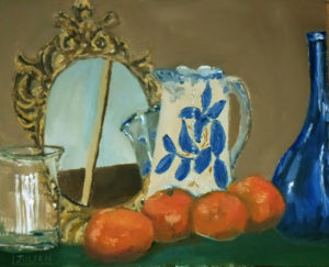 still life of oranges before a mirror